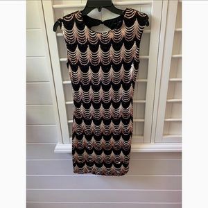 Short, black and gold sequined dress